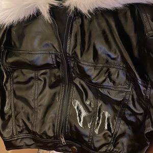 Black Zip Up Leather Jacket, Fur panel on top. Size Large.
